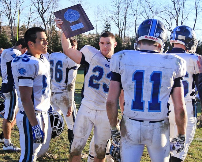 York senior captain Jack Neary stands with his teammates as he holds up the runners-up plaque during a ceremony after Saturday's Western Maine Class B championship game against Marshwood in South Berwick. Ioanna Raptis/Seacoastonline