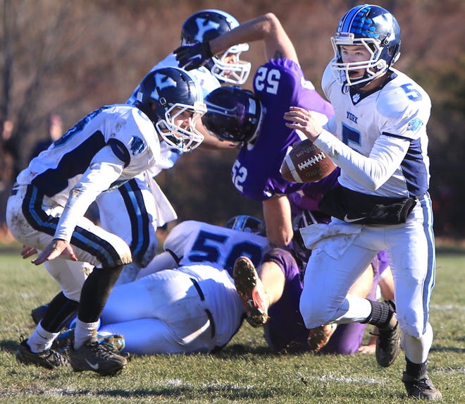 York High School quarterback Cole Merritt runs with the ball during Saturday's Western Maine Class B championship game against Marshwood in South Berwick. Ioanna Raptis/Seacoastonline