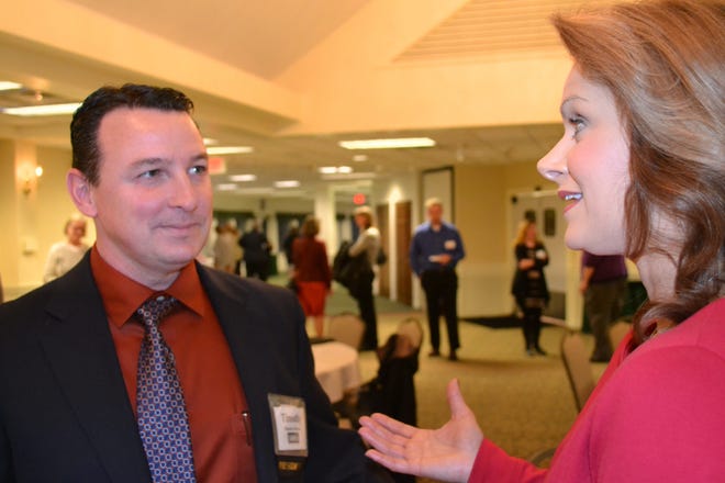 Timothy Dabrieo, left, president of the Seacoast Human Resources Association, talks with Dr. Kari Strobel, director of competencies for the Society for Human Resource Management. Strobel updated Seacoast association members on new certifications for HR professionals. Paul Briand photo