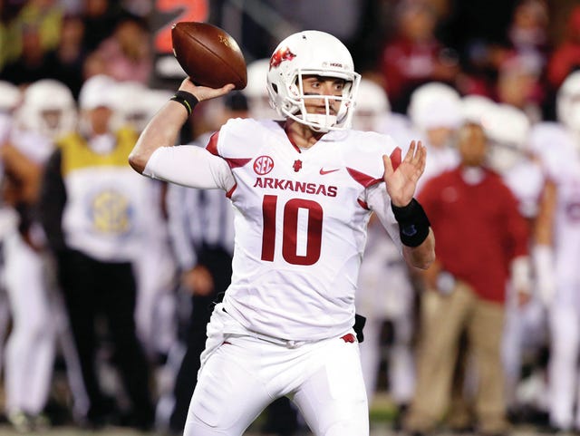 Arkansas quarterback Brandon Allen (10) readies to pass in the first half of an NCAA college football game against Mississippi State in Starkville, Miss., Saturday, Nov. 1, 2014. (AP Photo/Rogelio V. Solis)