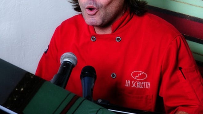 Chef/owner Giordy Tonelli singing to diners at La Scaletta in North Palm Beach’s Crystal Tree Plaza. (Contributed)