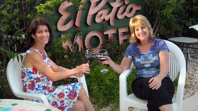 Key West — “Earthy” Jennifer and her best friend Kim O’Brien toast their friendship and birthdays while poolside at one of their favorite “old Florida” places to stay, El Patio Motel. (Photo provided by Jennifer Podis)