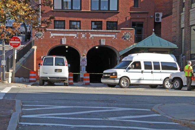 RIPTA vehicles, traffic barrels and tape block the entrance to the College Hill tunnel, which was closed after a leak was discovered Thursday night.