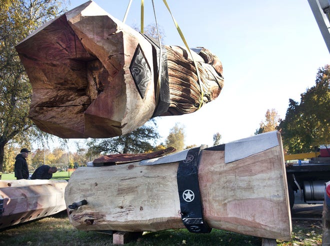 Crews begin erecting the world's tallest wooden nutcracker for the Umpqua Valley Festival of Lights.
