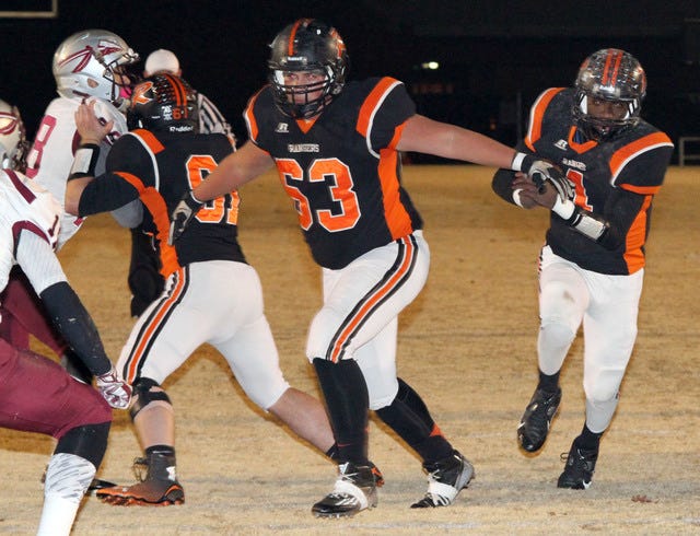 Jamie Mitchell • Times Record - Roland's Sirvante Knauls runs behind the block of Dalton O'Kelley, Friday, November 14, 2014, against Sequoyah-Tahlequah in the first quarter at Roland. 
 Jamie Mitchell • Times Record - Roland's Isaiah Chandler chases down a dropped pitch, Friday, November 14, 2014, during the Ranger's first series of downs against Sequoyah-Tahlequah at Roland. 
 Jamie Mitchell • Times Record - Roland's Kedrick Thomas looks to run to the outside, Friday, November 14, 2014, during first-half play against Sequoyah-Tahlequah at Roland.