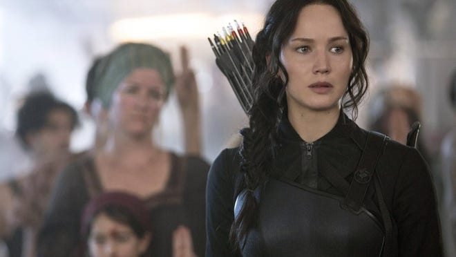 Jennifer Lawrence portrays Katniss Everdeen in a scene from “The Hunger Games: Mockingjay Part 1.”
