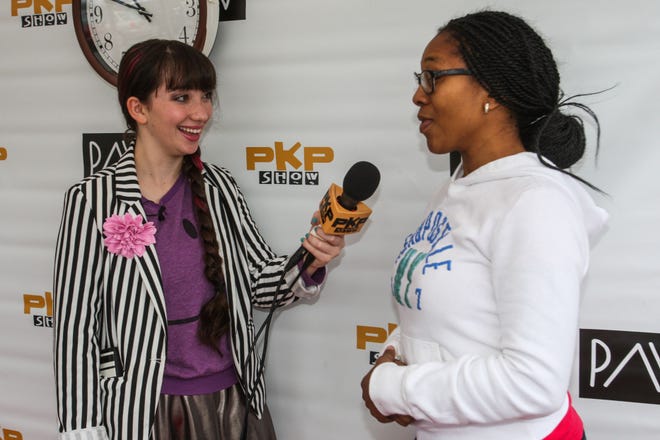 Pavlina Osta, left, interviews Tammara Spradley from DeLand. Osta is trying to break the Guinness world record for most radio interviews in 24 hours.