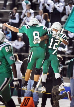 Choctaw's Quint Gornto and Marquise Kane celebrate Kane's 8-yard touchdown that put Choctaw up 19-14 in the first half.