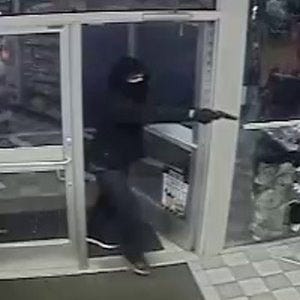 An armed robber enters a gas station on Granite Street in Braintree in January 2013.