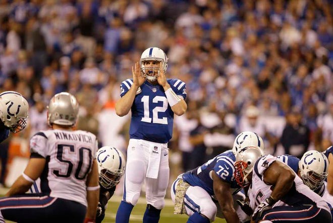 Indianapolis Colts quarterback Andrew Luck calls a play against the New England Patriots during the second half of an NFL football game in Indianapolis, Sunday, Nov. 16, 2014. (AP Photo/Darron Cummings)