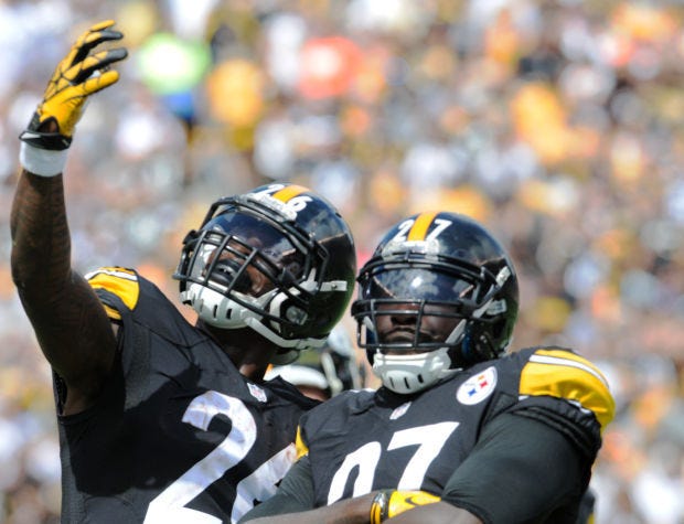 Steelers' LeGarrette Blount celebrates after his touch down with Le'Veon Bell during Sunday's game against the Browns on September 6, 2014.