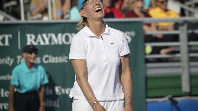 Martina Navratilova cracks up during the final match of the day at the Chris Evert/Raymond James 2014 Pro-Celebrity Tennis Classic in Delray Beach on Nov. 23, 2014. She was paired with Gavin Rossdale against Jon Lovitz and Chris Evert.