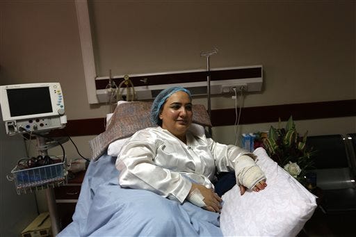 In this photo taken Sunday, Nov. 23, 2014, Afghan lawmaker Shukria Barakzai rests at a government hospital she was taken into after a suicide attack last week in Kabul, Afghanistan. Attacks in the capital Kabul have escalated since President Ashraf Ghani took office in September. Insurgent groups oppose the bilateral security agreement he signed with Washington, ratified by Parliament on Sunday, as well as his support for women's rights and peace talks with the Taliban. (AP Photo/Rahmat Gul)