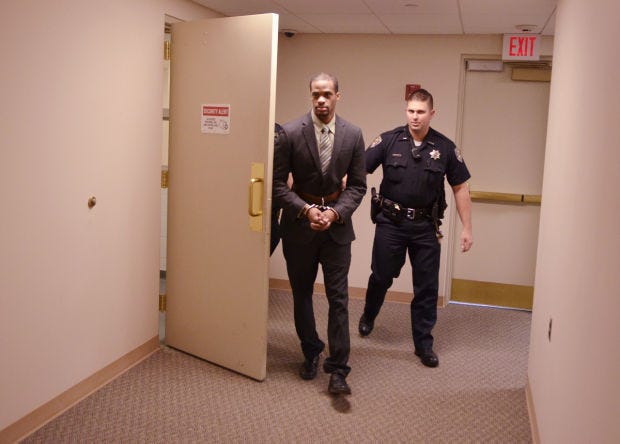 Beaver County deputy sheriffs lead Robert Burgess to the courtroom in October during jury deliberations in Burgess' double-homicide trial. A jury found him guilty of first-degree murder in the killings of Richard and Demetria Harper of Beaver Falls. He was sentenced to a double life sentence on Tuesday.