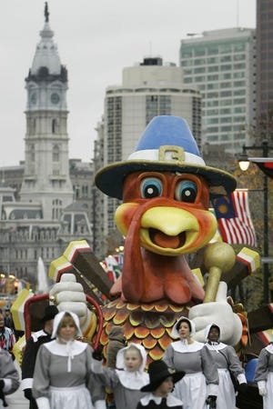 A parade float makes its way down the Benjamin Franklin Parkway with Philadelphia City Hall in the background at a recent Thanksgiving Day parade.