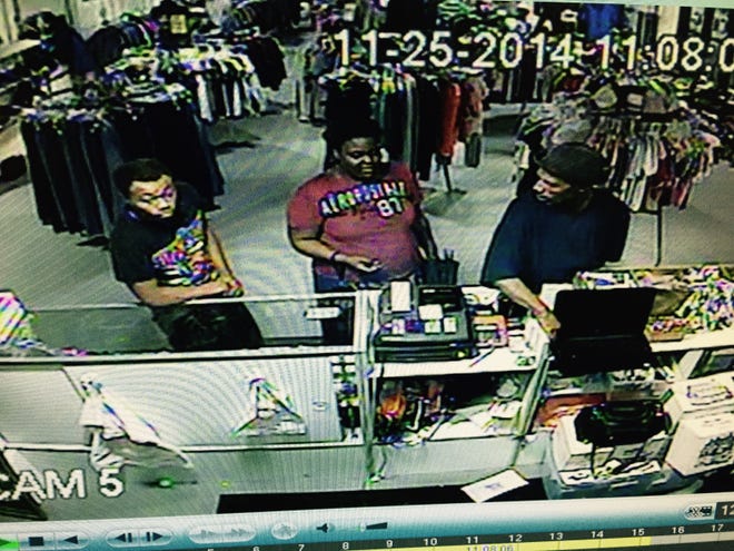 Provided by the ARNI Foundation
This still captured from surveillance video shows three suspects police say stole cash and a laptop from the ARNI Foundation's thrift store Tuesday, Nov. 25, 2014.