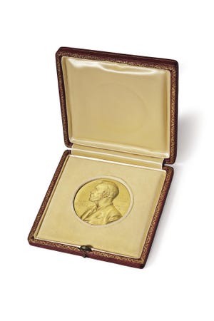 This image provided by Christie's auction house shows the 1962 Nobel Prize medal James Watson won for his role in the discovery of the structure of DNA. The medal is going on the auction block Dec. 4, 2014 at Christie's. (AP Photo/Mark Lennihan)