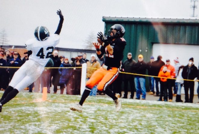 Stoughton's Alex Acciavatti scores with a 10-yard reception in the second quarter to give the Black Knights a 6-0 lead over Canton in the Thanksgiving Day game on Thursday, Nov. 27, 2014, at Stoughton High.