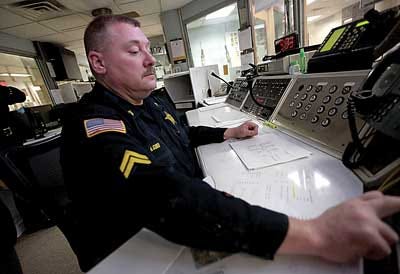Photo Illustration by Daniel Freel/New Jersey Herald Cpl. Alan Gruber, of the Sussex County Sheriff’s Office, mans the first floor command center at the Sussex County Jail.