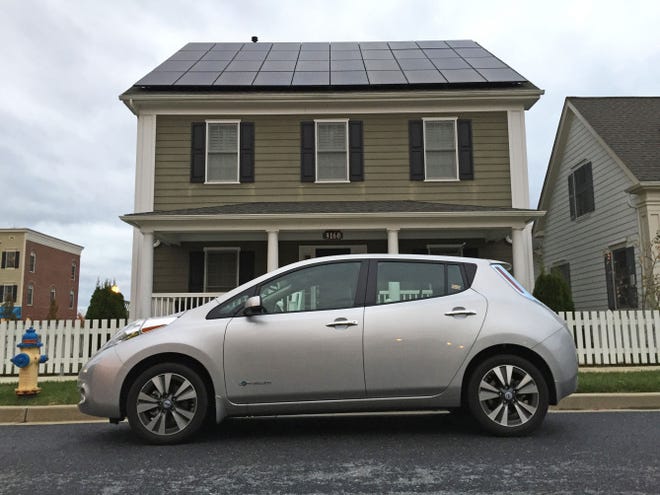 The solar array on Bill Webster's home in Frederick, Md., cost $36,740. After tax credits, his net cost was around $20,000. His all-electric Nissan Leaf uses about a third of the energy that his solar panels generate.