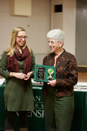 Virginia Ferris (right) receives an award for 55 years of service as a 4-H volunteer from 4-H Program Coordinator Nicole Grabowski.