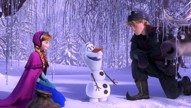 This image released by Disney shows, from left, Anna, voiced by Kristen Bell, Olaf, voiced by Josh Gad, and Kristoff, voiced by Jonathan Groff in a scene from the animated feature “Frozen.”