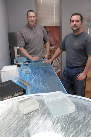 Mark Morin, left, and Clint Hopkins, partners in Lucid Glass Studio in East Providence.