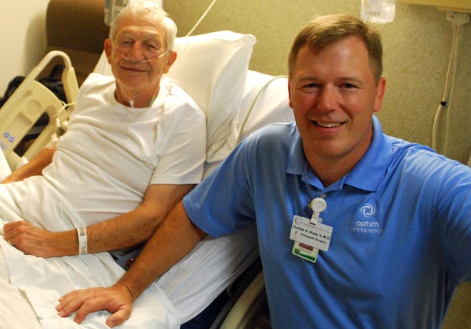 Samuel Harmon, the 100th joint replacement patient in October at St. Joseph's/Candler; (right) his orthopedic surgeon Dr. Charles Hope.