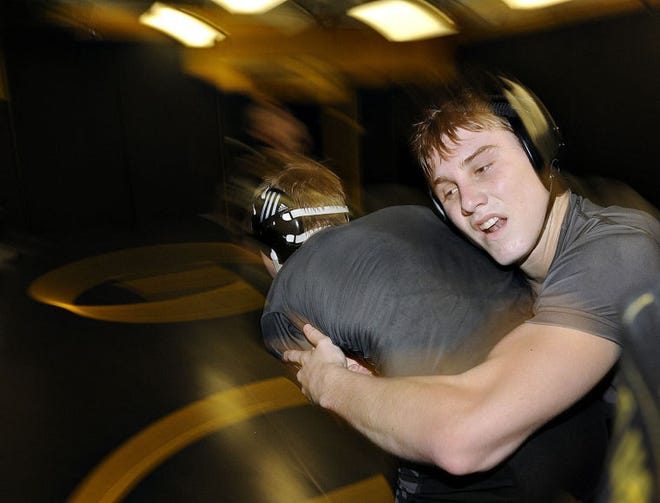 feature shot of Archbishop Wood's Chad Haegele, who will be the subject of the Courier wrestling previews.
