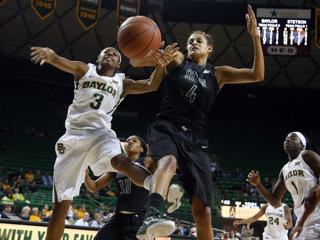 Stetson center Amber Porter, right, battles Baylor forward Chardonae Fuqua' for a loose rebound during the second half Saturday in Waco, Texas.