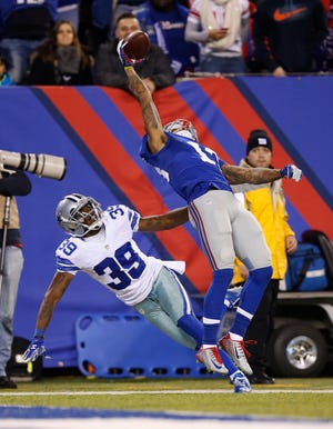 Giants wide receiver Odell Beckham Jr. (13) makes a one-handed catch for a touchdown against Cowboys cornerback Brandon Carr (39) in the second quarter last Sunday. The catch has caught the attention of Jacksonville coach Gus Bradley: "He's playing at a high level. His athleticism, his route-running, the ability to accelerate and get out of his breaks." The Associated Press