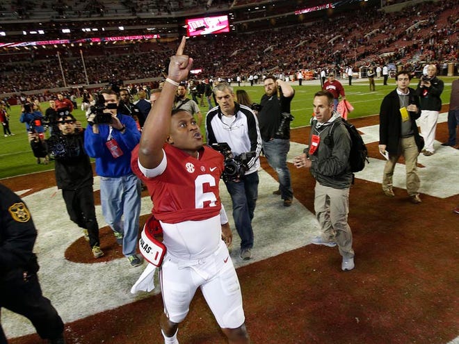 Alabama quarterback Blake Sims celebrates after the Crimson Tide’s victory. Sims was 20 of 27 passing for 312 yards with four touchdowns and three interceptions.