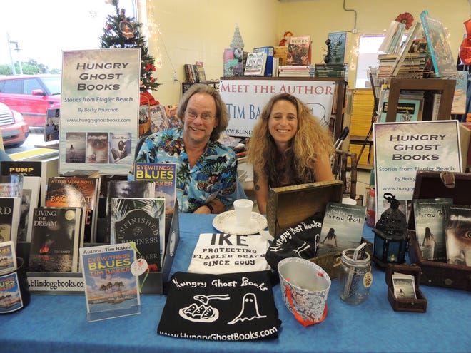 Flagler County authors Tim Baker and Becky Meyer Pourchot display their array of titles during the grand opening of Change Jar Books’ new location in Flagler Beach.