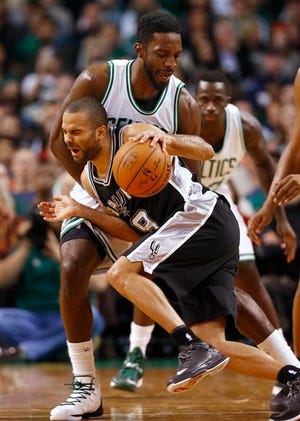 The Spurs' Tony Parker runs into the Celtics' Jeff Green during the second half of Sunday's game. San Antonio won 111-89. AP Photo/Winslow Townson