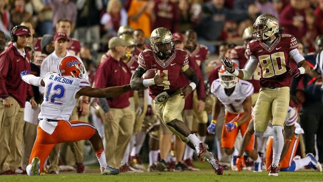 Dalvin Cook #4 of the Florida State Seminoles rushes during a game against the Florida Gators at Doak Campbell Stadium on November 29, 2014 in Tallahassee, Florida. (Photo by Mike Ehrmann/Getty Images)