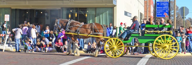 Scotty, a 19-year-old Clydesdale horse, gives carriage rides Saturday through downtown Lindsborg in front of the J.O. Sundstrom Conference Center.