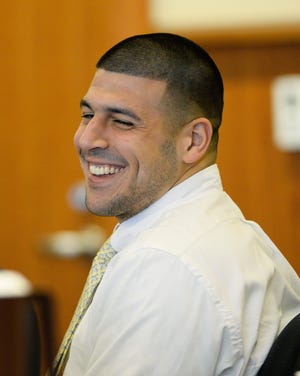 Patriots coach Bill Belichick and owner Robert Kraft are among the potential witnesses in the upcoming murder trial of Aaron Hernandez, shown here smiling during an October court appearance.