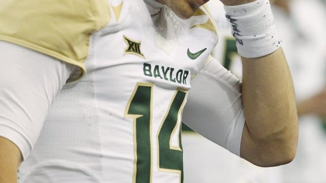 Baylor quarterback Bryce Petty stands on the sidelines Saturday during the second half of the Bears’ victory over Texas Tech. Petty suffered a concussion against the Red Raiders, but he said Monday that he expects to play this week against Kansas State. (Tim Sharp/AP Photo)