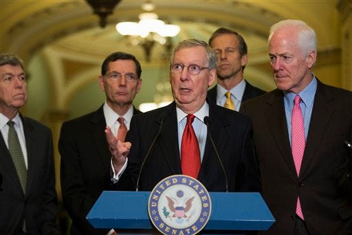 Senate Minority Leader Mitch McConnell of Ky., center, gestures during a news conference on Capitol Hill in Washington, Tuesday, Dec. 2, 2014. From left are, Sen. Roy Blunt, R-Mo., Sen. John Barrasso, R-Wyo., McConnell, Sen. John Thune, R-S.D., and Senate Minority Whip John Cornyn of Texas. (AP Photo/Evan Vucci)