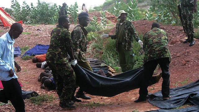 Soldiers and investigators examine the bodies at the scene after Somali militants killed 36 non-Muslim quarry workers near the north Kenyan town of Mandera on Tuesday, Dec. 2, 2014. The attackers from the al-Shabab group shot the non-Muslims dead after separating them from Muslims, residents said. (Fabian Mangera/Xinhua/Zuma Press/TNS)