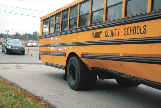 No one was injured in a Tuesday afternoon school bus accident on Nashville Highway. A 2014 Chevy Impala collided with a bus carrying about 50 students from E.A. Cox Middle School shortly after 3 p.m. (Staff photo by Susan W. Thurman)