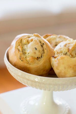This photo shows potato knishes. Though there are many variations of the knish, they essentially are the hand pie of classic Jewish cuisine: a baked, though sometimes fried, light pastry dough filled with mashed vegetables, often potatoes, or meat.