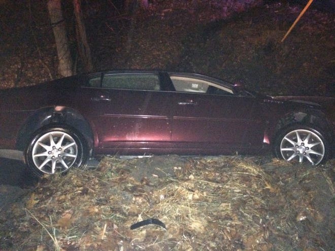 A blue Chevrolet and a maroon Buick ended up in a deep ravine along the side of the road after colliding in Solebury Tuesday.