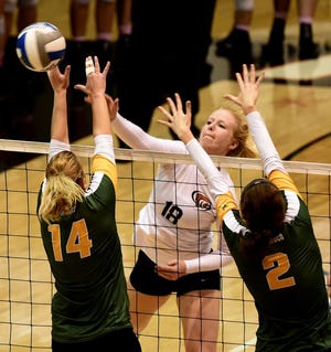 University of Pacific outside hitter Katy Tagart hits past the block of University of San Francisco's Taylor Poncetta and Valentina Zaloznik in a match this season. The Tigers, despite records of 24-7 overall and 13-5 in the West Coast Conference, were snubbed from the NCAA Tournament. ROGER WOO/FOR THE RECORD