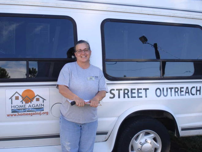 Street Outreach Coordinator Kristen Reddick stands in front of the van donated to Home Again St. Johns for street outreach.