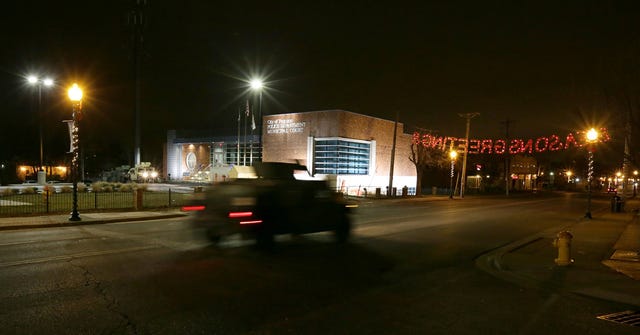 A Missouri National Guard Humvee rolls past the Ferguson Police department during a patrol on South Florissant Road in Ferguson at 11:20 p.m. on Monday, Dec. 1, 2014. The streets of Ferguson had little to no foot traffic and no sustained protests of any kind on Monday night. (David Carson/St. Louis Post-Dispatch/TNS)