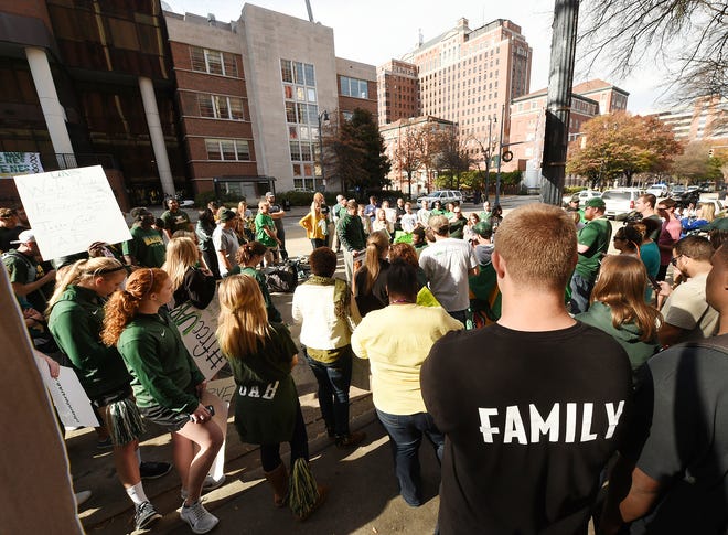 The University of Alabama at Birmingham (UAB) students rally in front of the UAB Administration building on 20th Street South in Birmingham, Ala.,Tuesday, Dec. 2, 2014, to try and save the UAB football program. It was the third day of protests following media reports that the school is shutting down football. (AP Photo/al.com, Joe Songer)