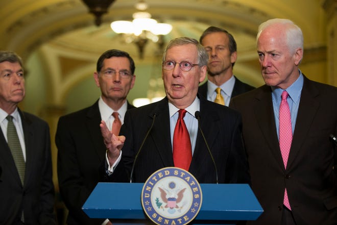 Senate Minority Leader Mitch McConnell of Ky., center, gestures during a news conference Tuesday on Capitol Hill in Washington. From left are, Sen. Roy Blunt, R-Mo., Sen. John Barrasso, R-Wyo., McConnell, Sen. John Thune, R-S.D., and Senate Minority Whip John Cornyn of Texas.