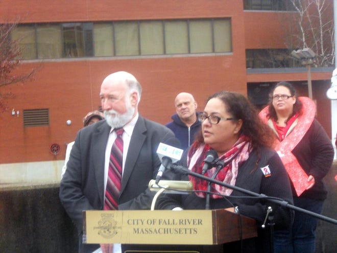 Connie Rocha-Mimoso, director of community health at Seven Hills Behavioral Health, speaks about World AIDS Day and the battle still being waged against the disease in Fall River on Wednesday on Gromada Plaza. Next to her is Board of Health chief Dr. Henry Vaillancourt.