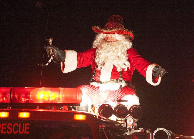 In this file photo, Santa winds up the the Christmas Parade on Pennsylvania Ave. in Dunnellon, Fla., on Saturday, Dec. 7, 2013.